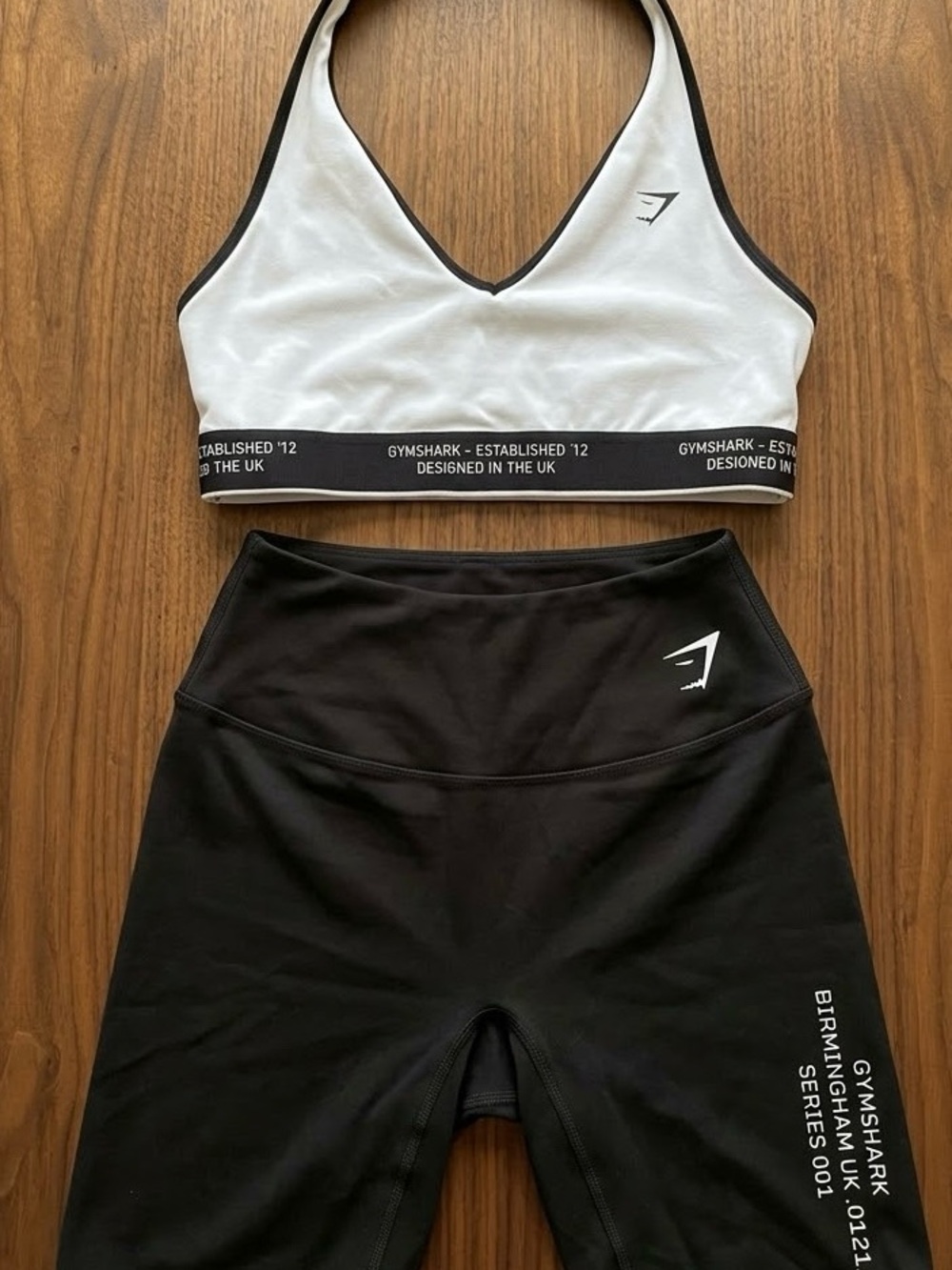 Gymshark White & Black V‑Neck Sports Bra with Black High‑Waist Shorts